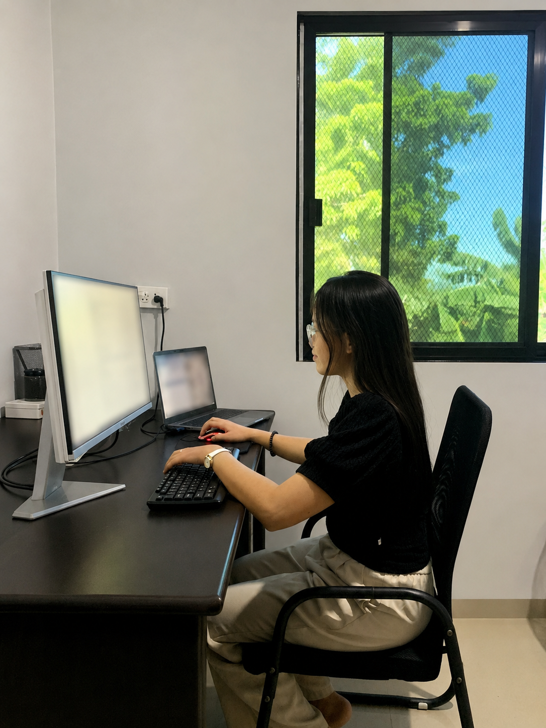 Team member working at her workstation